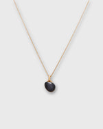 Load image into Gallery viewer, Tiny Ceramic Egg Pendant Necklace in Soot/Gold