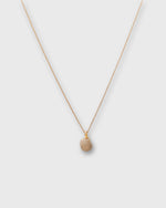 Load image into Gallery viewer, Tiny Ceramic Egg Pendant Necklace in Cream/Gold
